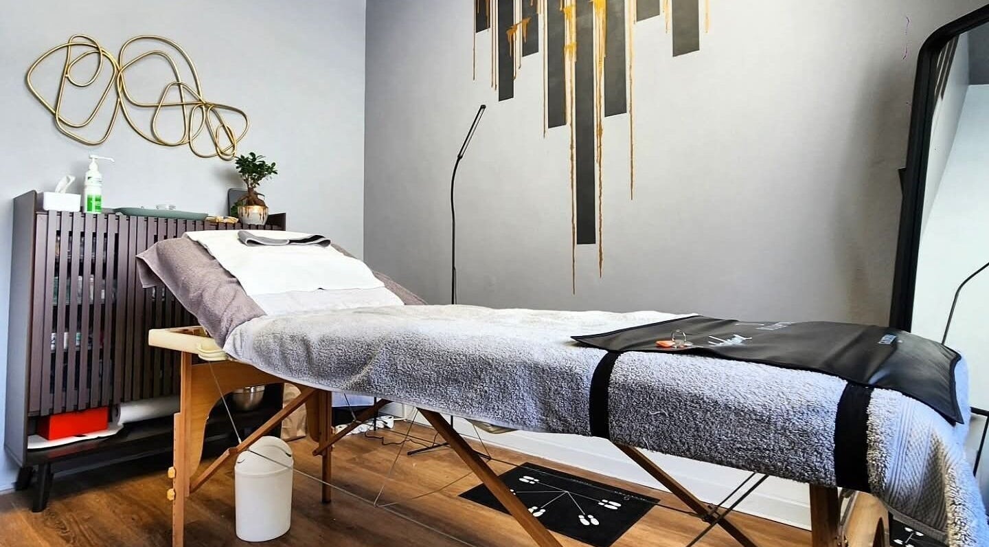 Calm therapy room at Smu_th in the city | Dr.K, Cape Town, Western Cape, ZA with a comfortable massage table.