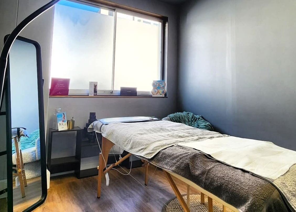 Tranquil massage room at Smu_th in the city | Dr.K, Cape Town, featuring a plush massage bed and calming decor.