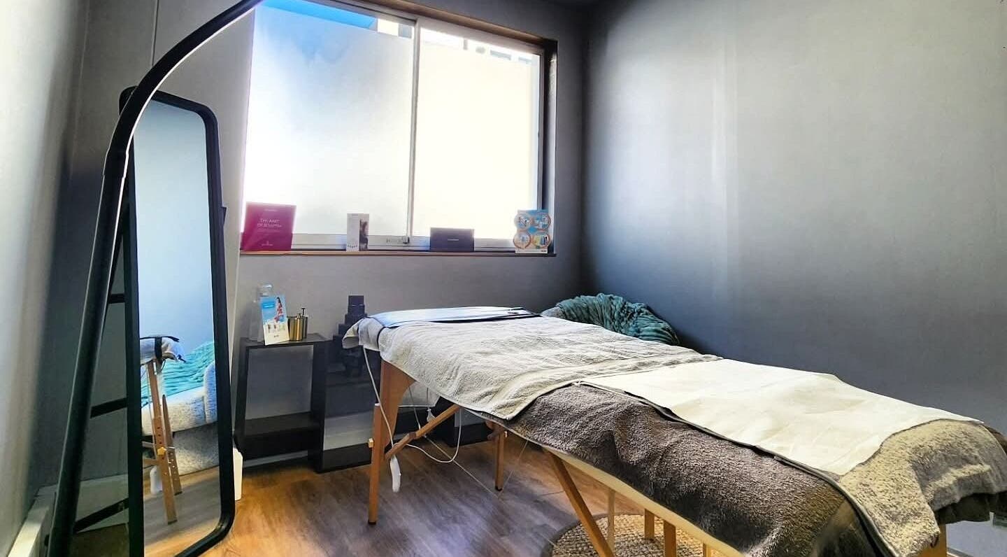 Tranquil massage room at Smu_th in the city | Dr.K, Cape Town, featuring a plush massage bed and calming decor.