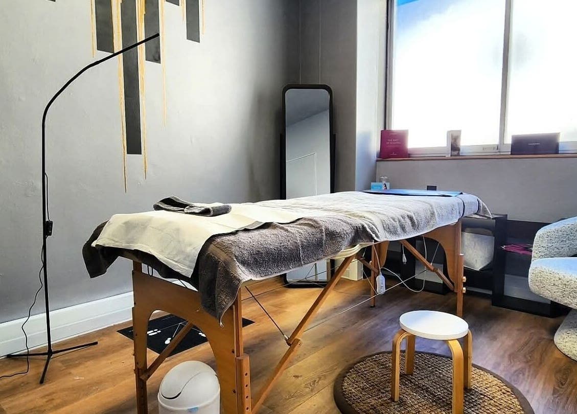 Relaxing spa room at Smu_th in the city | Dr.K, Cape Town, Western Cape, ZA. Cozy massage table and ambient decor.
