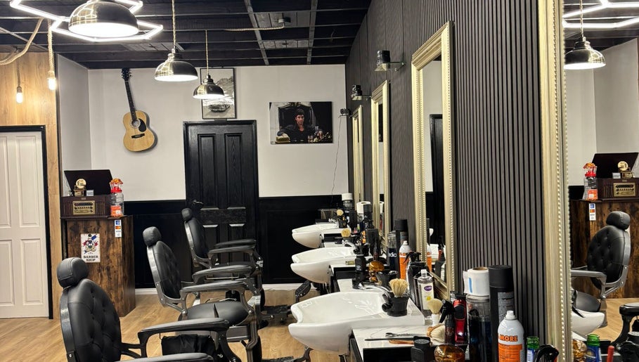 Elegant barber chairs in MOSS Salon, London, England, GB, with stylish decor and modern lighting.
