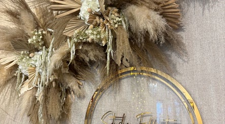 Stylish rustic floral decor at Amy Rose Hair, Newcastle-under-Lyme, enhancing the serene salon ambiance.