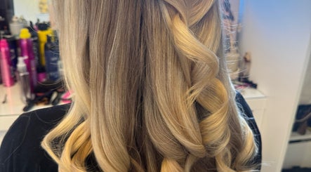 Blonde hair styled in elegant curls at Amy Rose Hair, Newcastle-under-Lyme, England, GB.