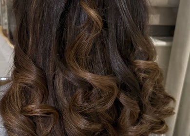 Stylish brown curls at Amy Rose Hair, Newcastle-under-Lyme, England, GB.