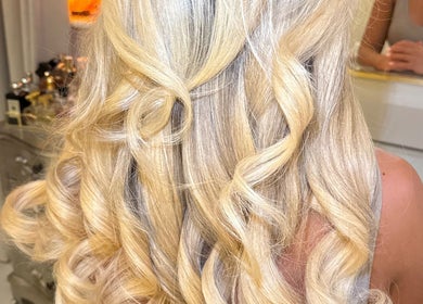 Blonde hair in elegant curls at Amy Rose Hair, Newcastle-under-Lyme, England, GB, showcasing salon's styling expertise.