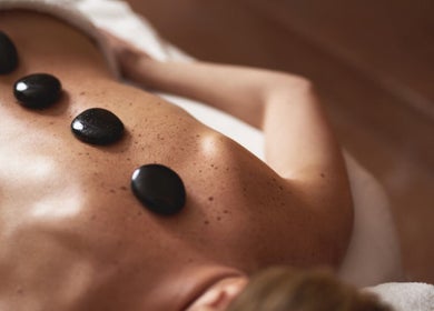 Hot stone massage at thaii in Velké Poříčí, Královéhradecký Kraj, CZ offering relaxation and wellness.