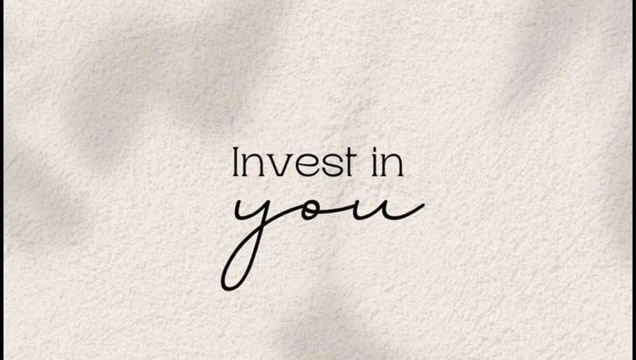 Motivational quote 'Invest in you' on a textured background at Juste Vaiciene, Peterborough, England, GB.