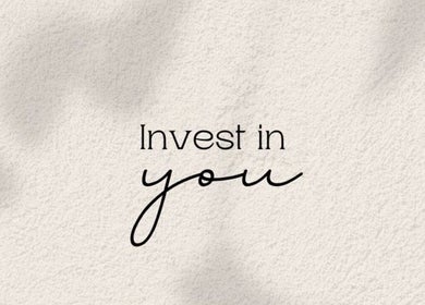 Motivational quote 'Invest in you' on a textured background at Juste Vaiciene, Peterborough, England, GB.