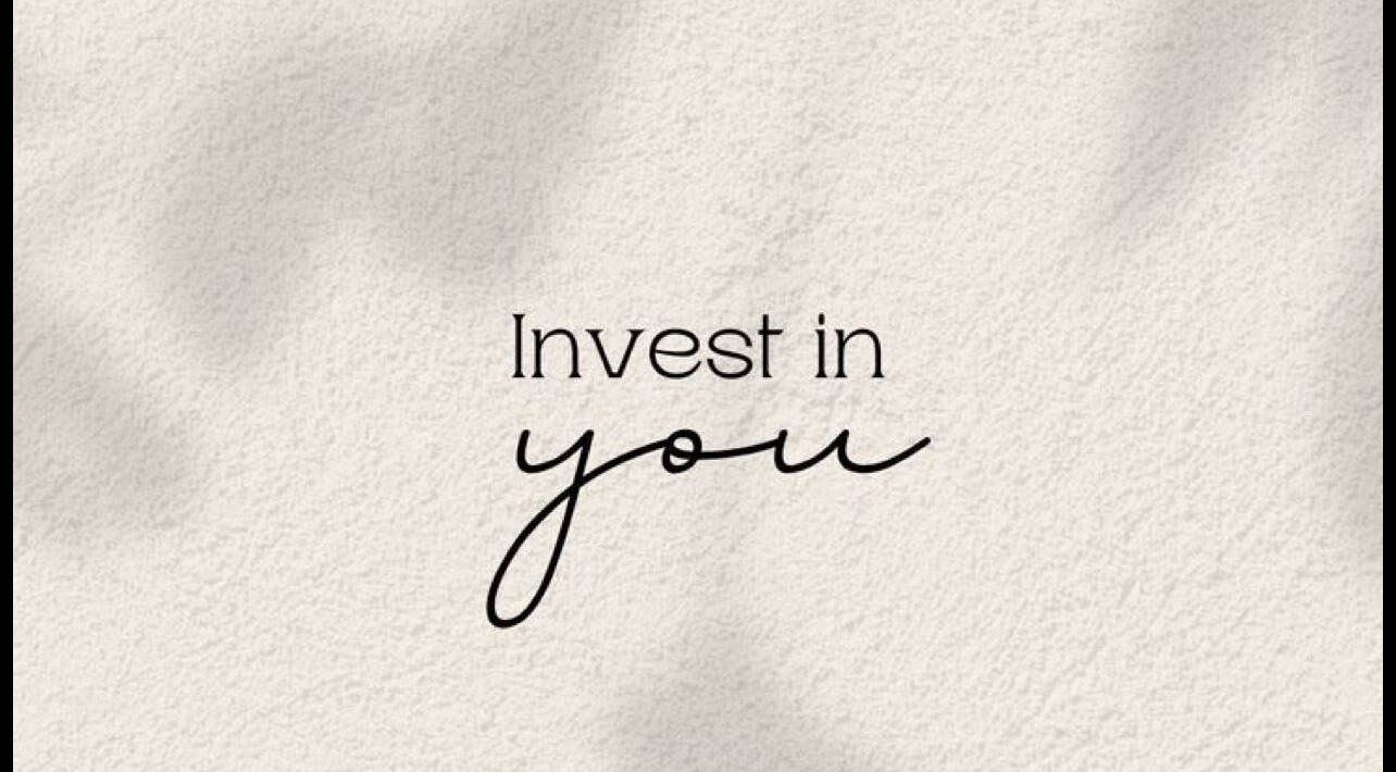 Motivational quote 'Invest in you' on a textured background at Juste Vaiciene, Peterborough, England, GB.