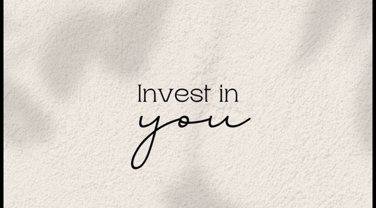 Motivational quote 'Invest in you' on a textured background at Juste Vaiciene, Peterborough, England, GB.