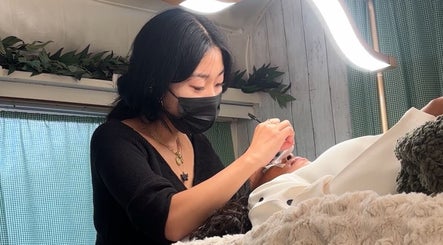 Lash Ark technician performs eyelash extension in Worcester Park, England, GB for a client.