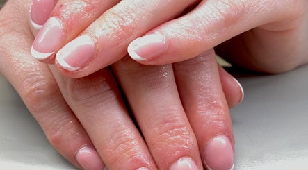 Close-up of a French manicure done at Sarah’s Lounge, Stockport, England, GB, showcasing elegant nail design.