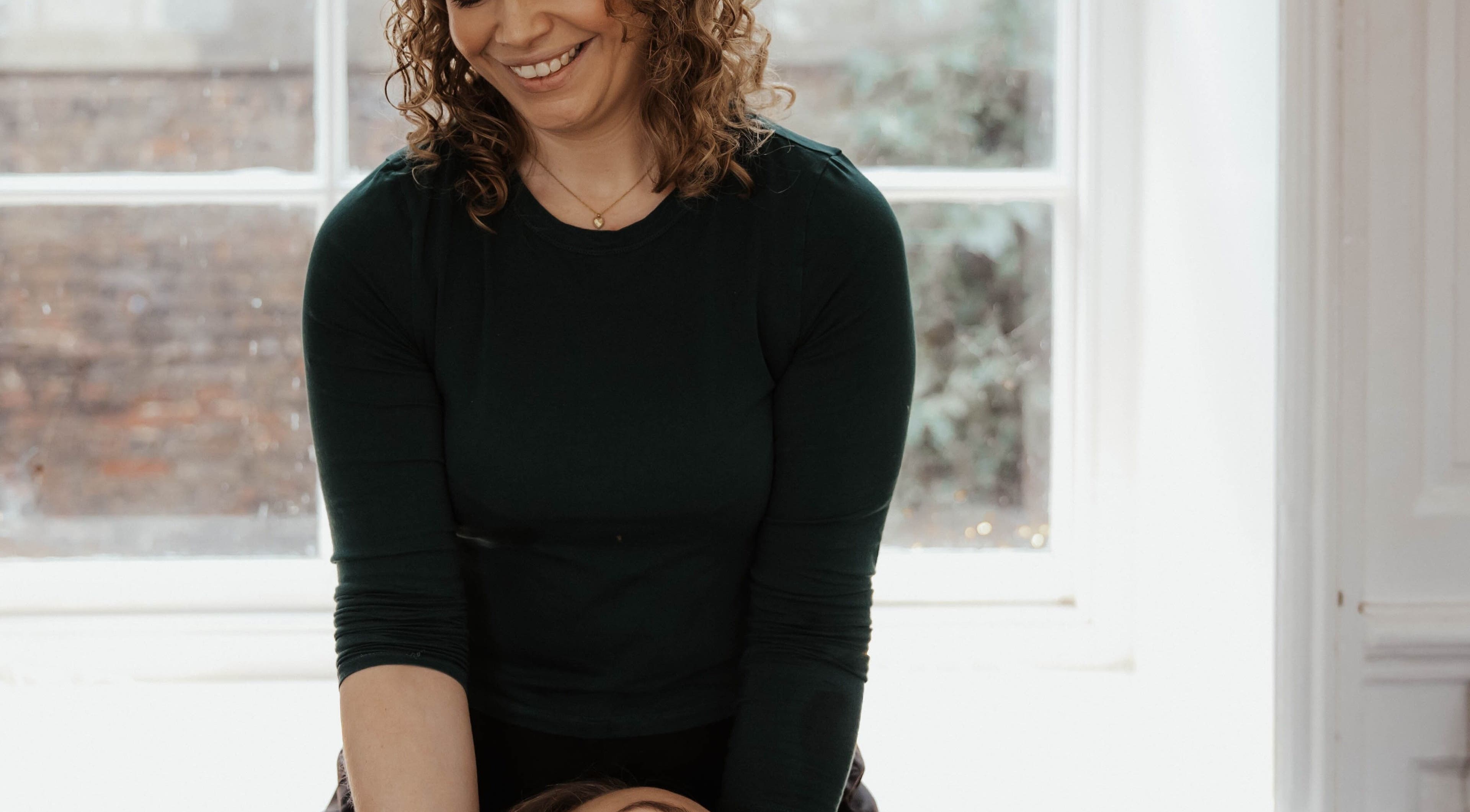 Therapist at The Elsewhere in Norwich, England, GB provides a relaxing massage session.