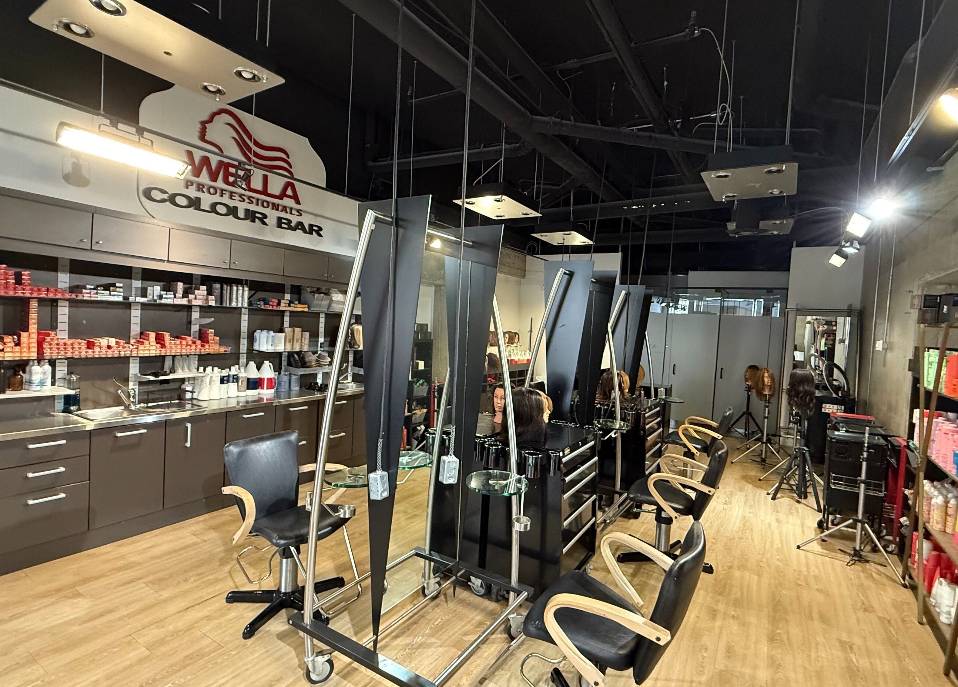 Modern salon interior at HairXtacy Academy Graduates, Burlington, Ontario, CA, featuring hairdressing stations.