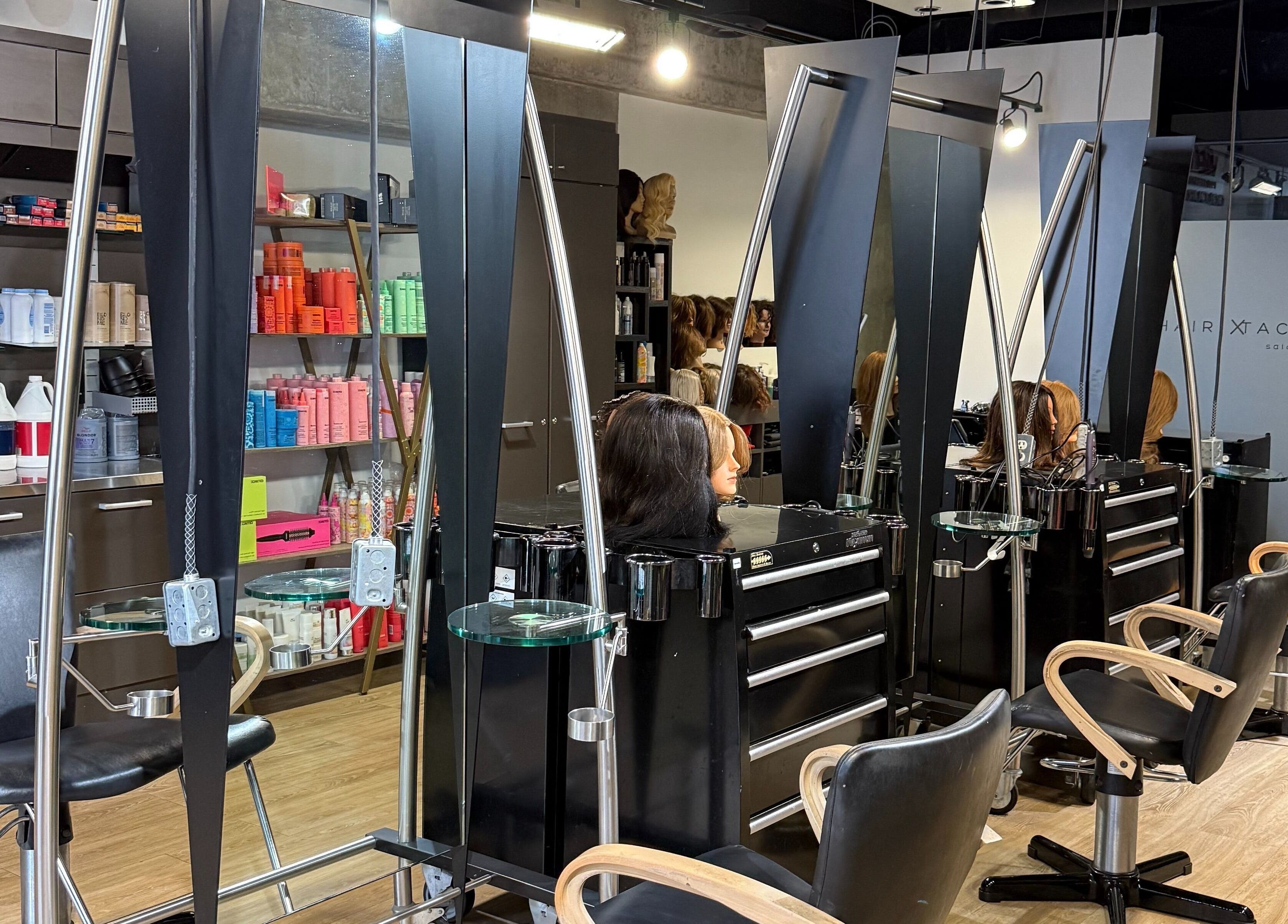 Modern salon stations at Hairxtacy Academy Graduates in Burlington, Ontario, CA, showcasing professional styling tools.