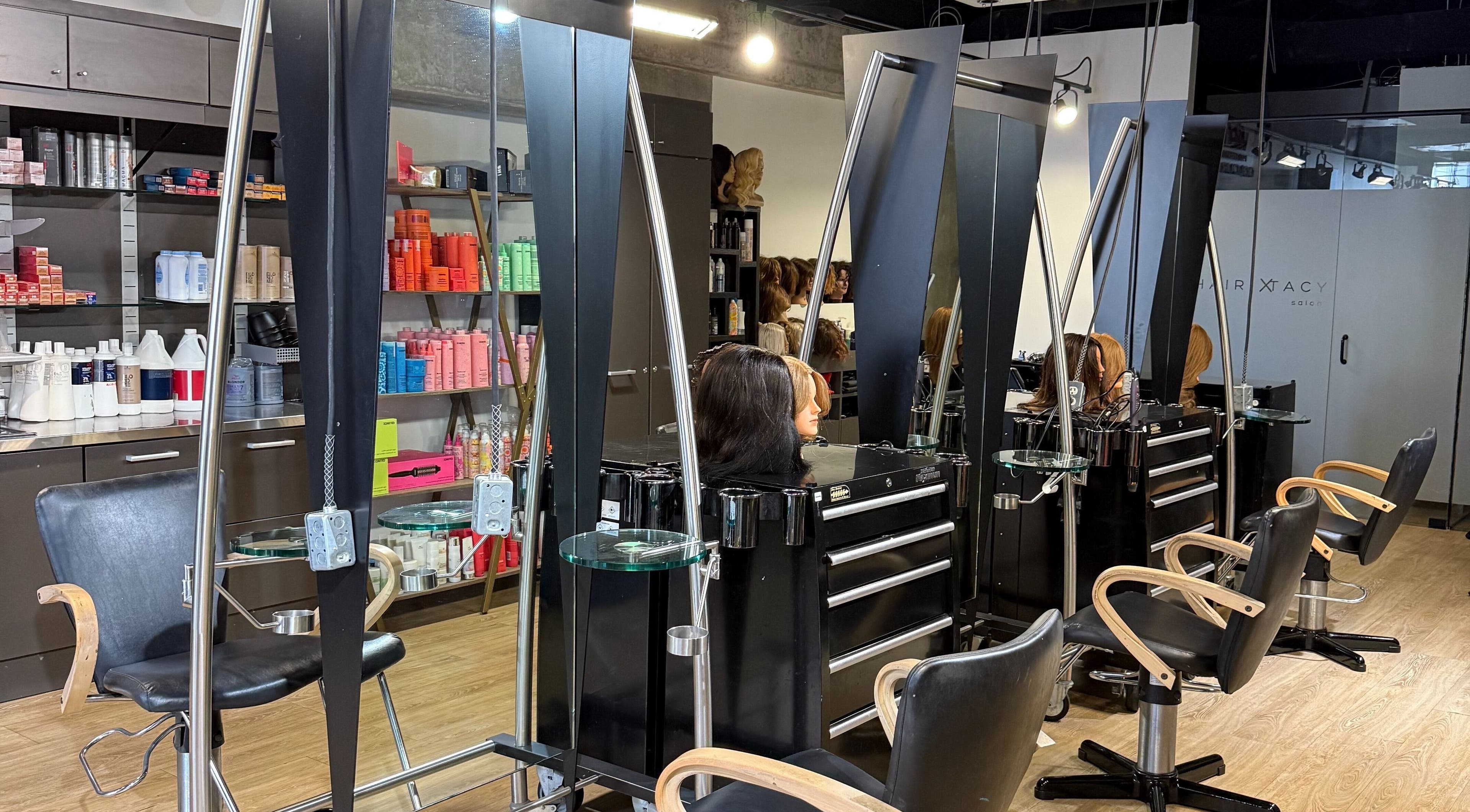 Modern salon stations at Hairxtacy Academy Graduates in Burlington, Ontario, CA, showcasing professional styling tools.