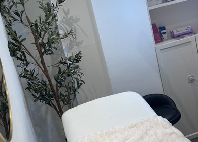 Tranquil treatment room at Lumora Aesthetics, London, England, GB, featuring soothing decor and calming ambiance.