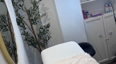 Tranquil treatment room at Lumora Aesthetics, London, England, GB, featuring soothing decor and calming ambiance.