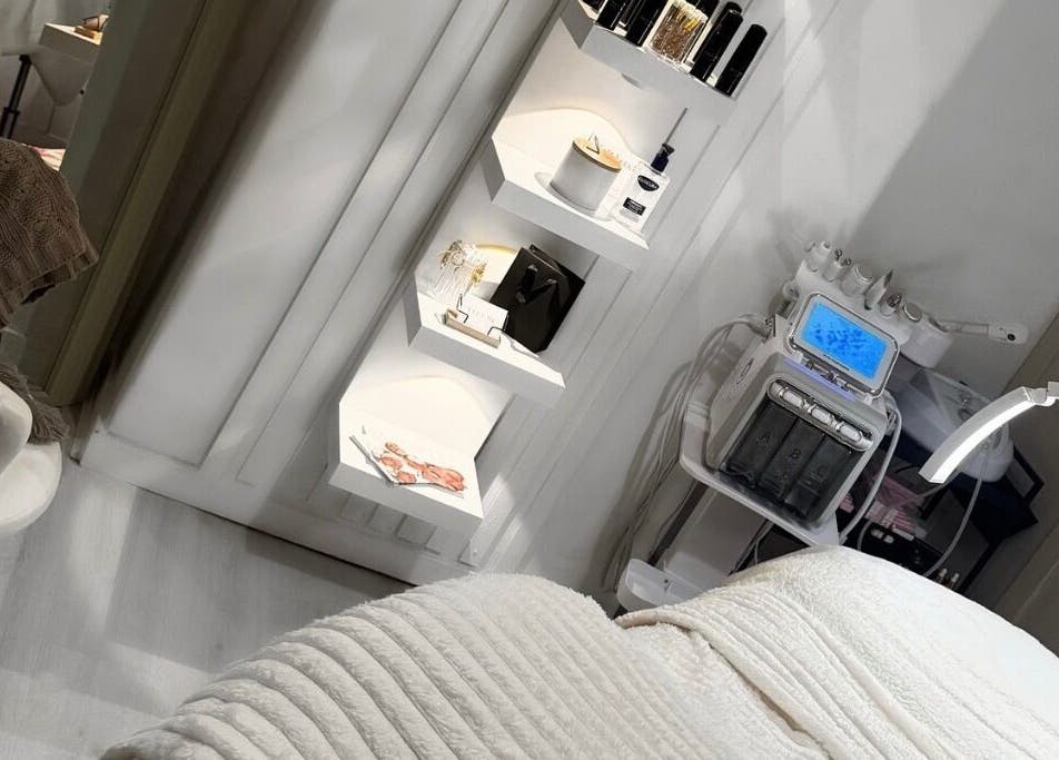 Elegant treatment room at ELLUME SKIN & AESTHETICS in Little Chalfont, England, GB with modern equipment.