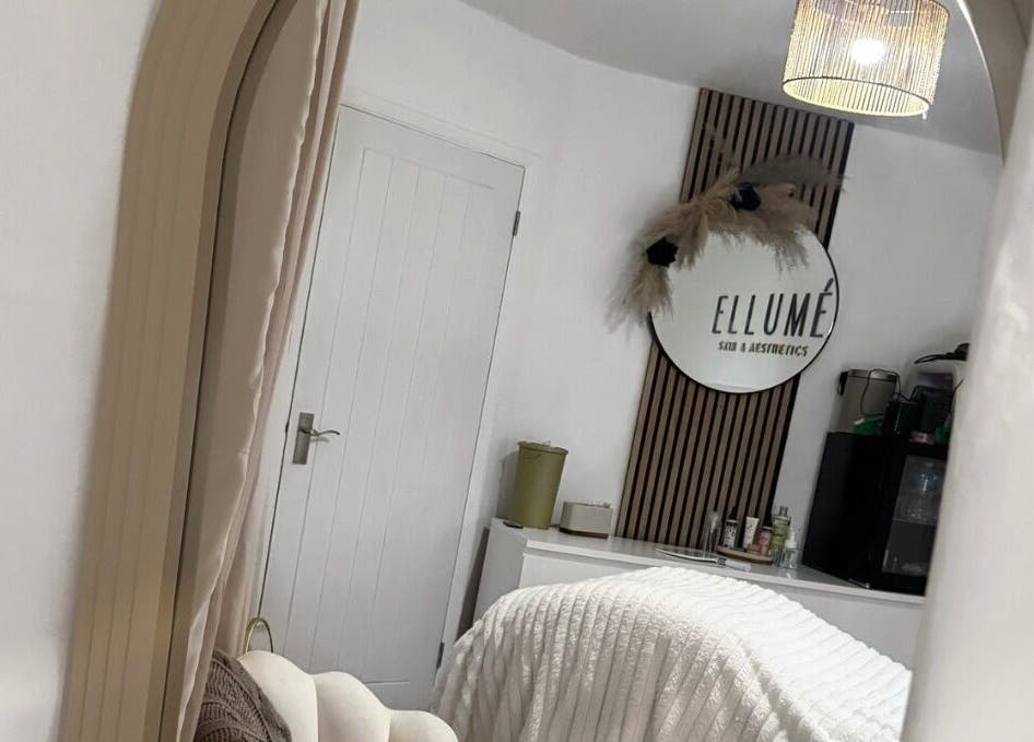 Serene treatment room at ELLUME SKIN & AESTHETICS, Little Chalfont, England, GB with stylish decor.