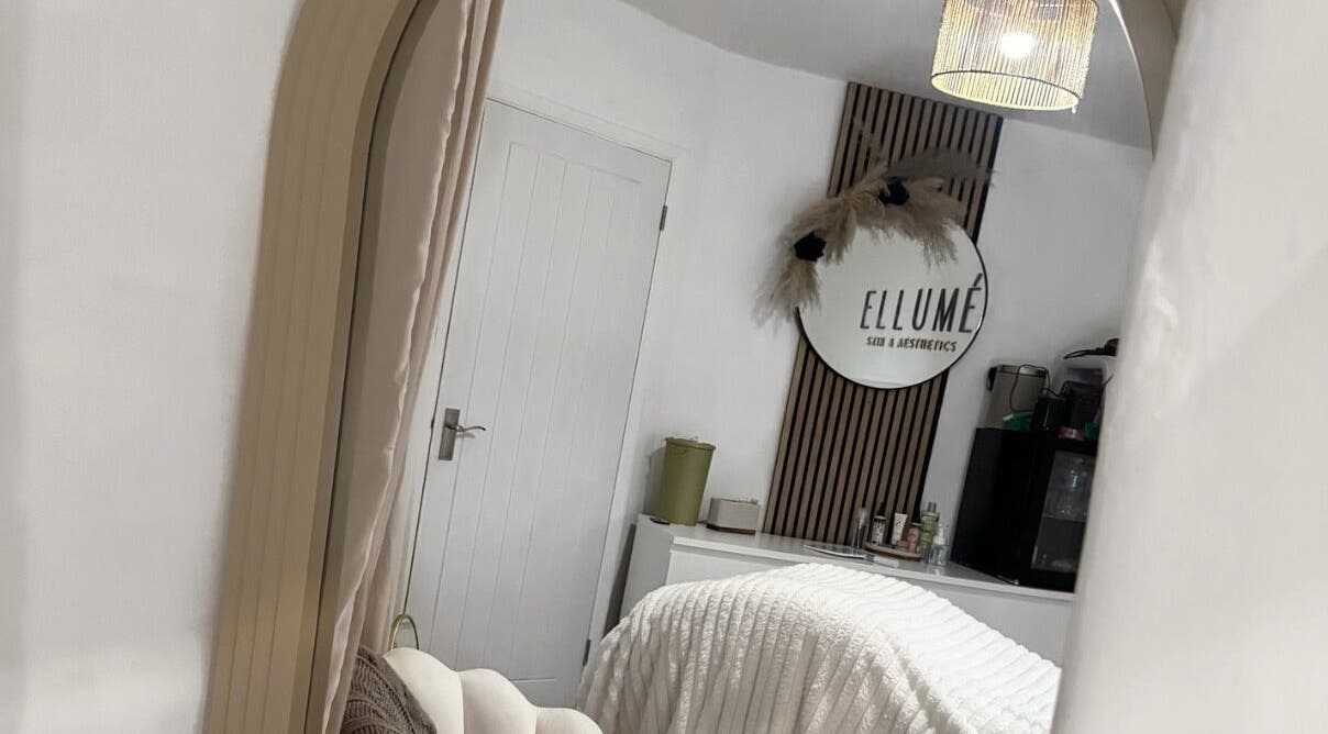 Serene treatment room at ELLUME SKIN & AESTHETICS, Little Chalfont, England, GB with stylish decor.