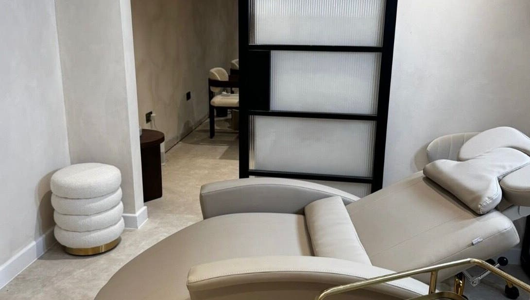 Tranquil treatment room at ELLUMÉ SKIN @ TONES HEMEL, Hemel Hempstead, England, GB, showcasing a plush chair.