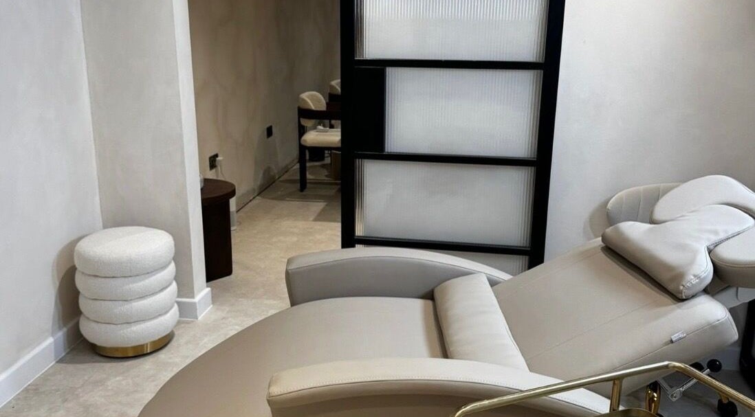Tranquil treatment room at ELLUMÉ SKIN @ TONES HEMEL, Hemel Hempstead, England, GB, showcasing a plush chair.