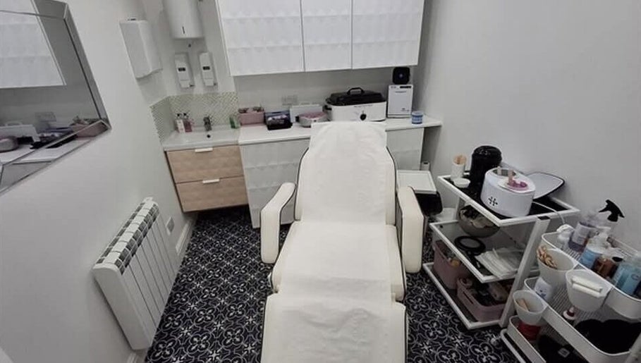 Treatment room at The Rogue Collective, Barnsley, England, GB. Plush chair and organized beauty equipment.