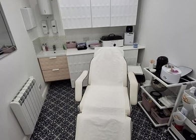 Treatment room at The Rogue Collective, Barnsley, England, GB. Plush chair and organized beauty equipment.