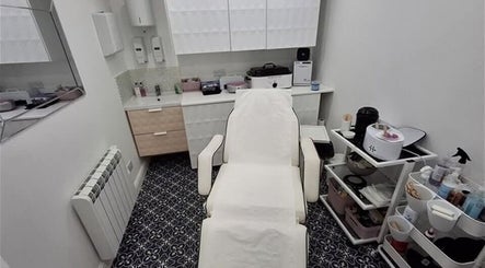 Treatment room at The Rogue Collective, Barnsley, England, GB. Plush chair and organized beauty equipment.