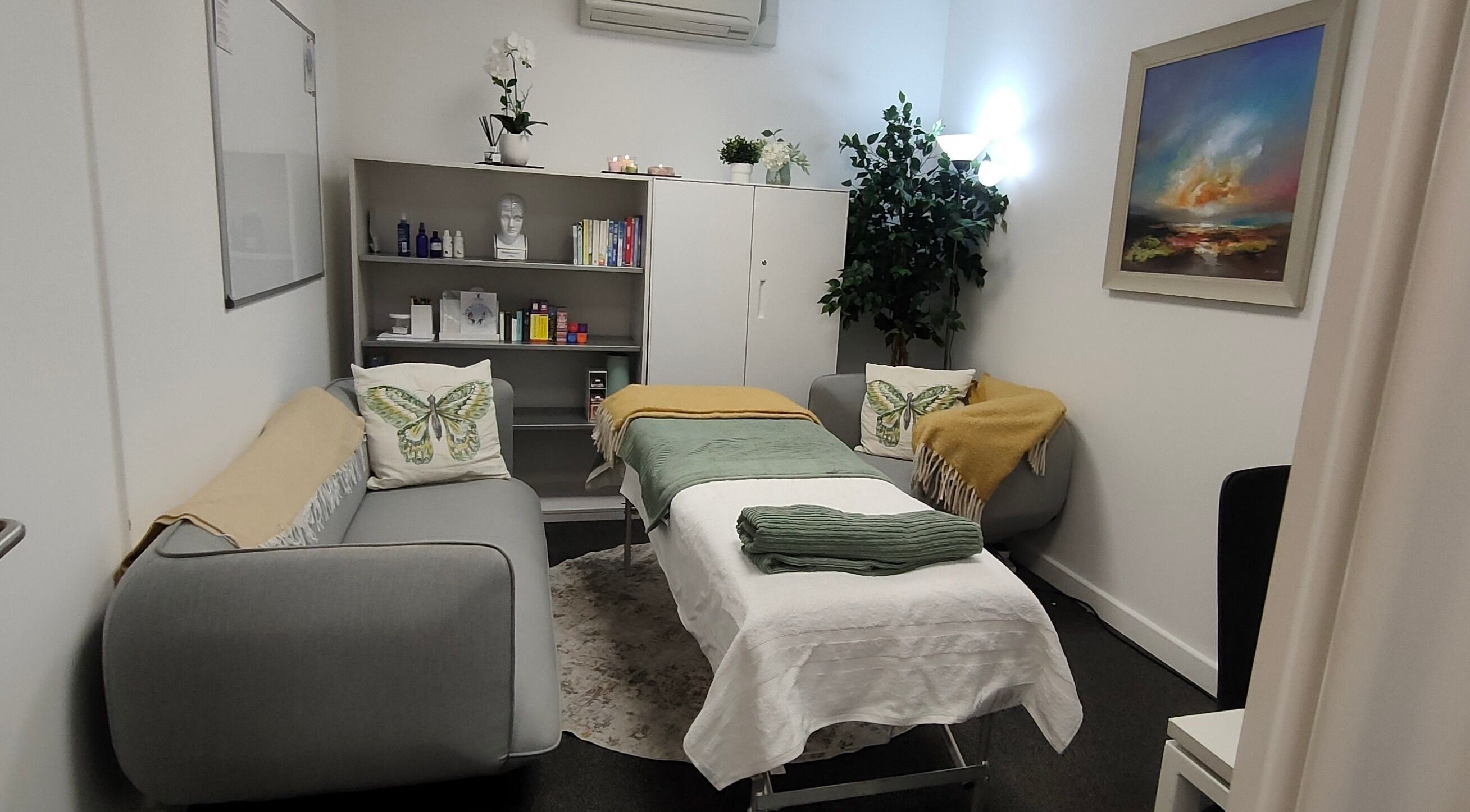 Relaxing therapy room at Revive N Recharge, Warley, England, GB with cozy decor and soothing ambiance.