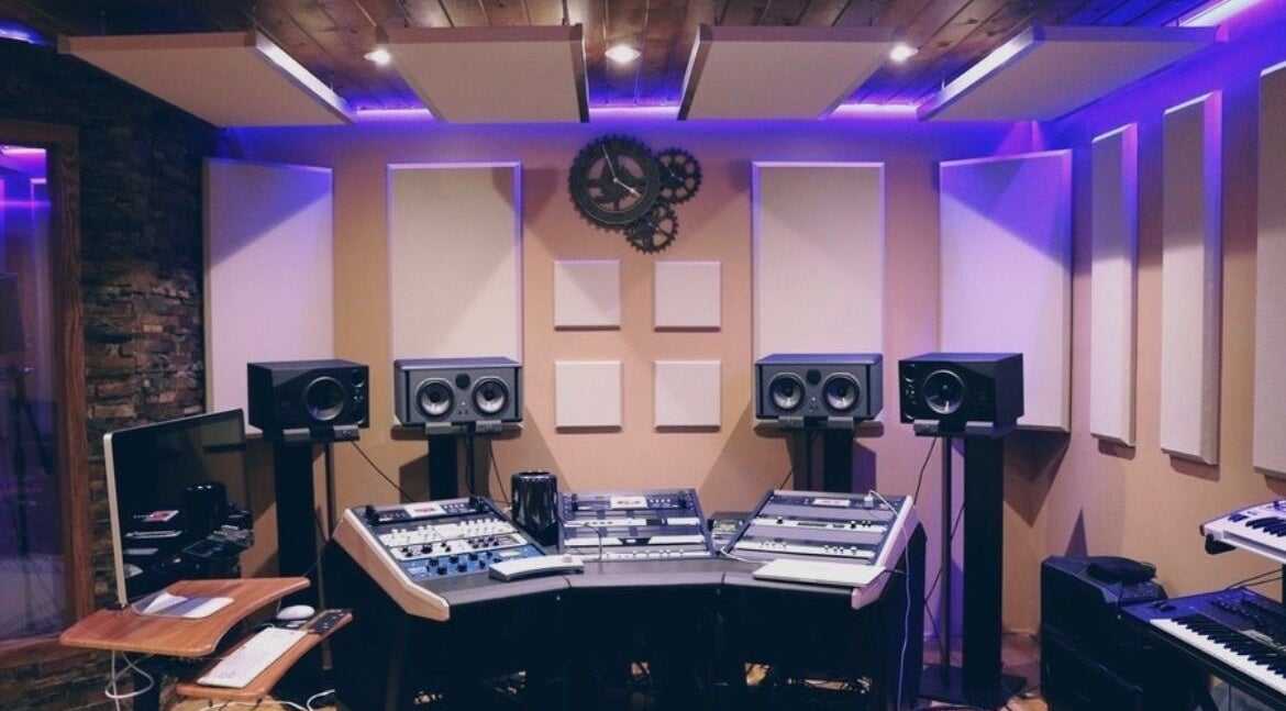 Modern recording studio at CapStars Records, Mesa, Arizona, US, with high-tech audio equipment and speakers.