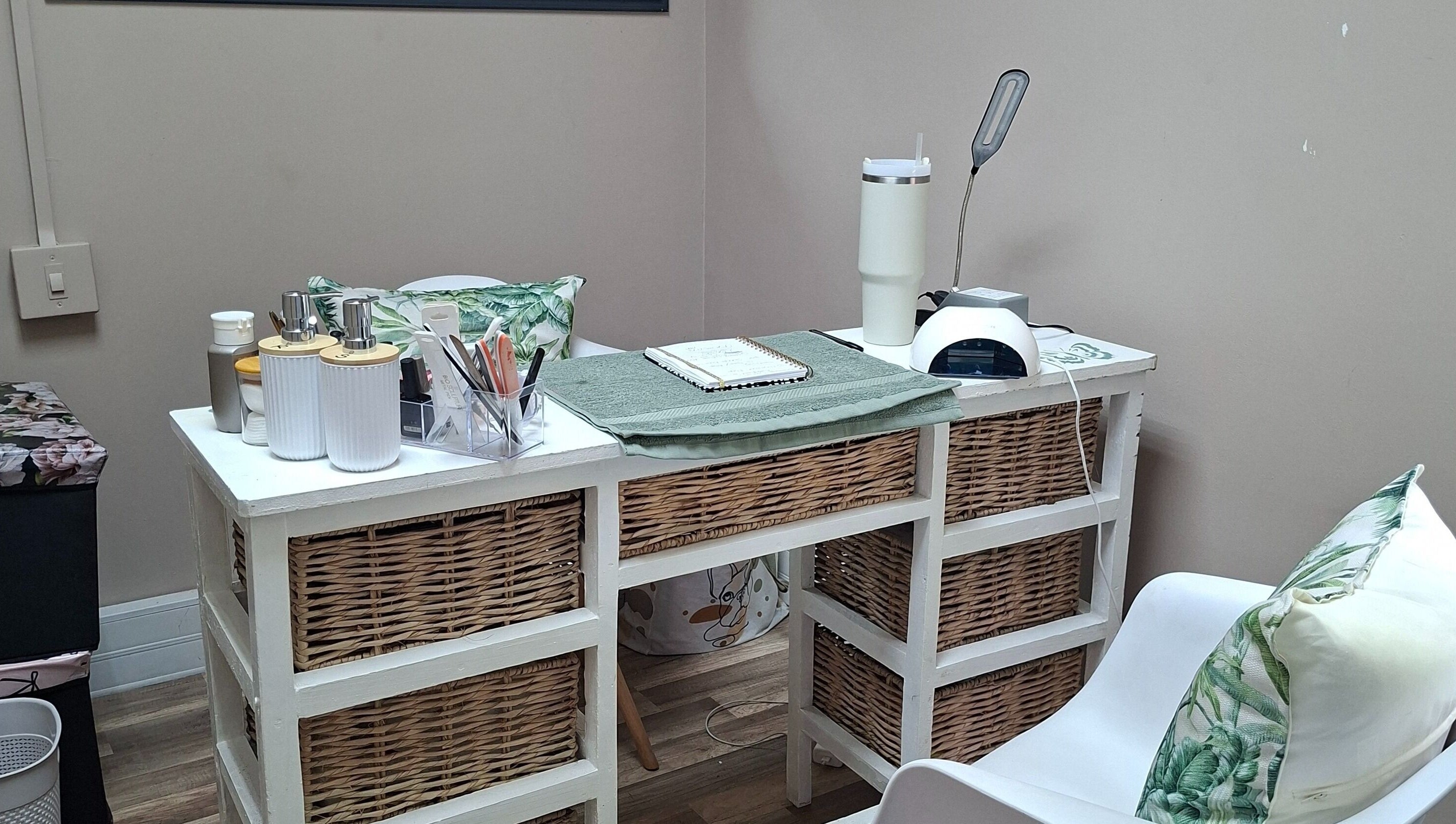 Elegant nail salon desk at Enchanted Nails by Tania in Pretoria, Gauteng, ZA offering a serene setup.