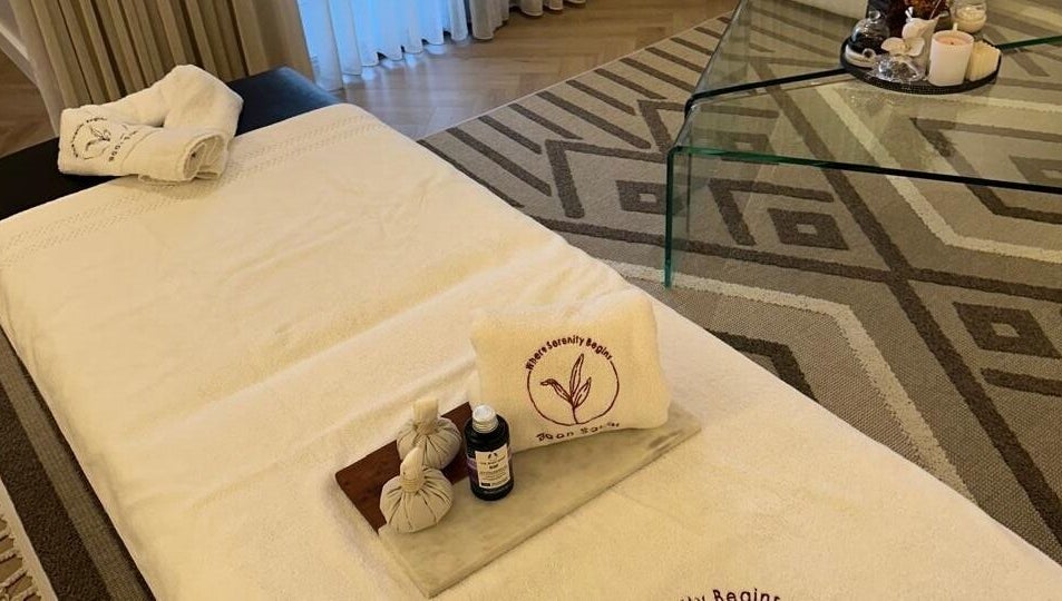 Relaxing spa setup at Baan Sabai, Riyadh, featuring plush towels and soothing oils for ultimate wellness.
