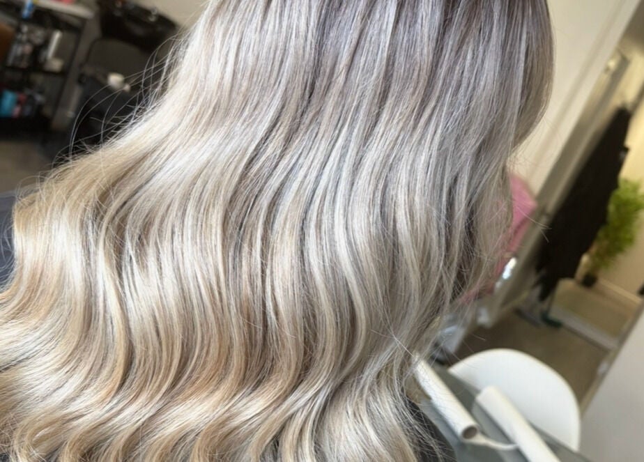 Beautiful wavy blonde hair styled at Hair by Sandra in Falkirk, Scotland, GB.