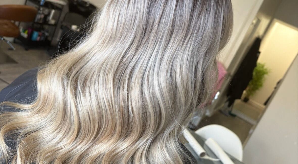 Beautiful wavy blonde hair styled at Hair by Sandra in Falkirk, Scotland, GB.