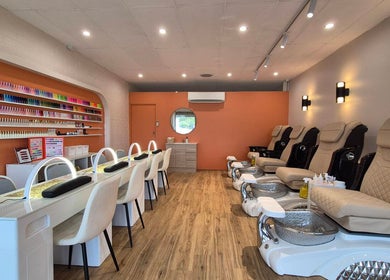 Modern interior of Sala Nails & Spa in Gosnells, Western Australia, AU with cream chairs and nail polish display.