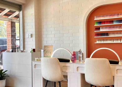 Nail bar at Sala Nails & Spa in Gosnells, Western Australia, AU with vibrant polish display and modern decor.