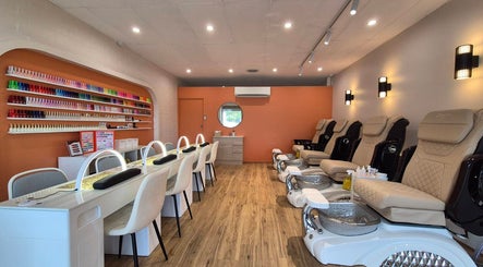 Chic interior of Sala Nails & Spa in Gosnells, Western Australia, AU featuring manicure stations and pedicure chairs.