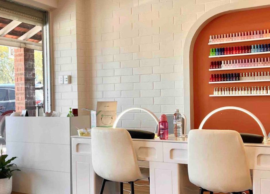 Modern nail station at Sala Nails & Spa, Gosnells, Western Australia, AU with colorful polishes on display.