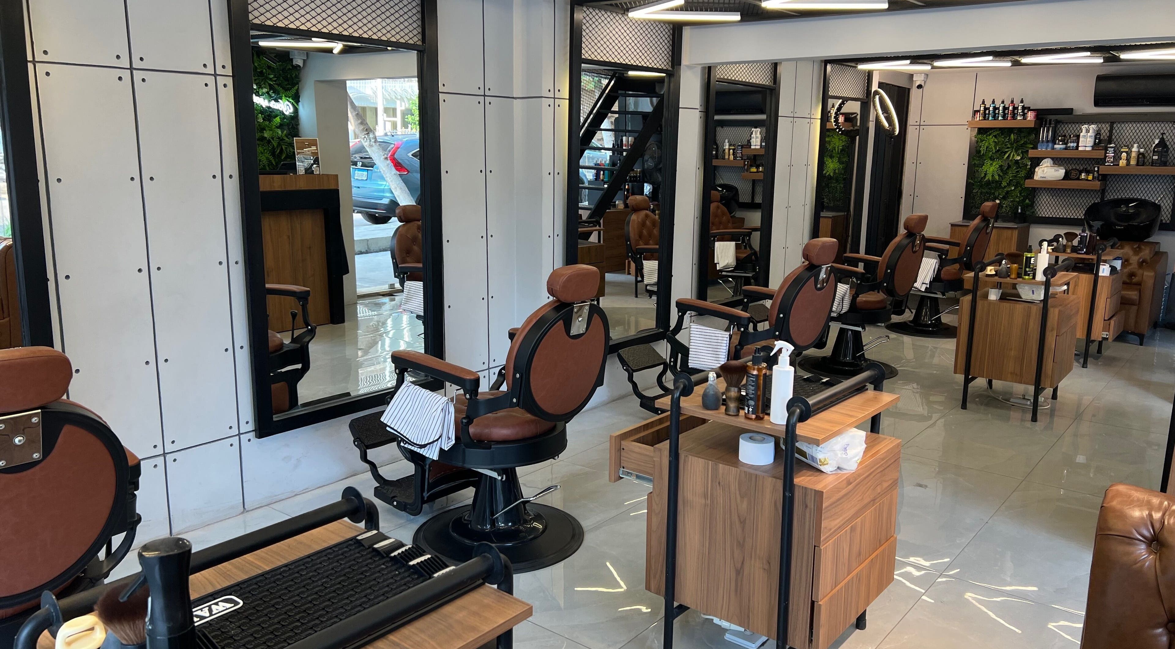 Modern salon interior at Hair Spot, Tarablus, North Governorate, LB with stylish barber chairs and mirrors.