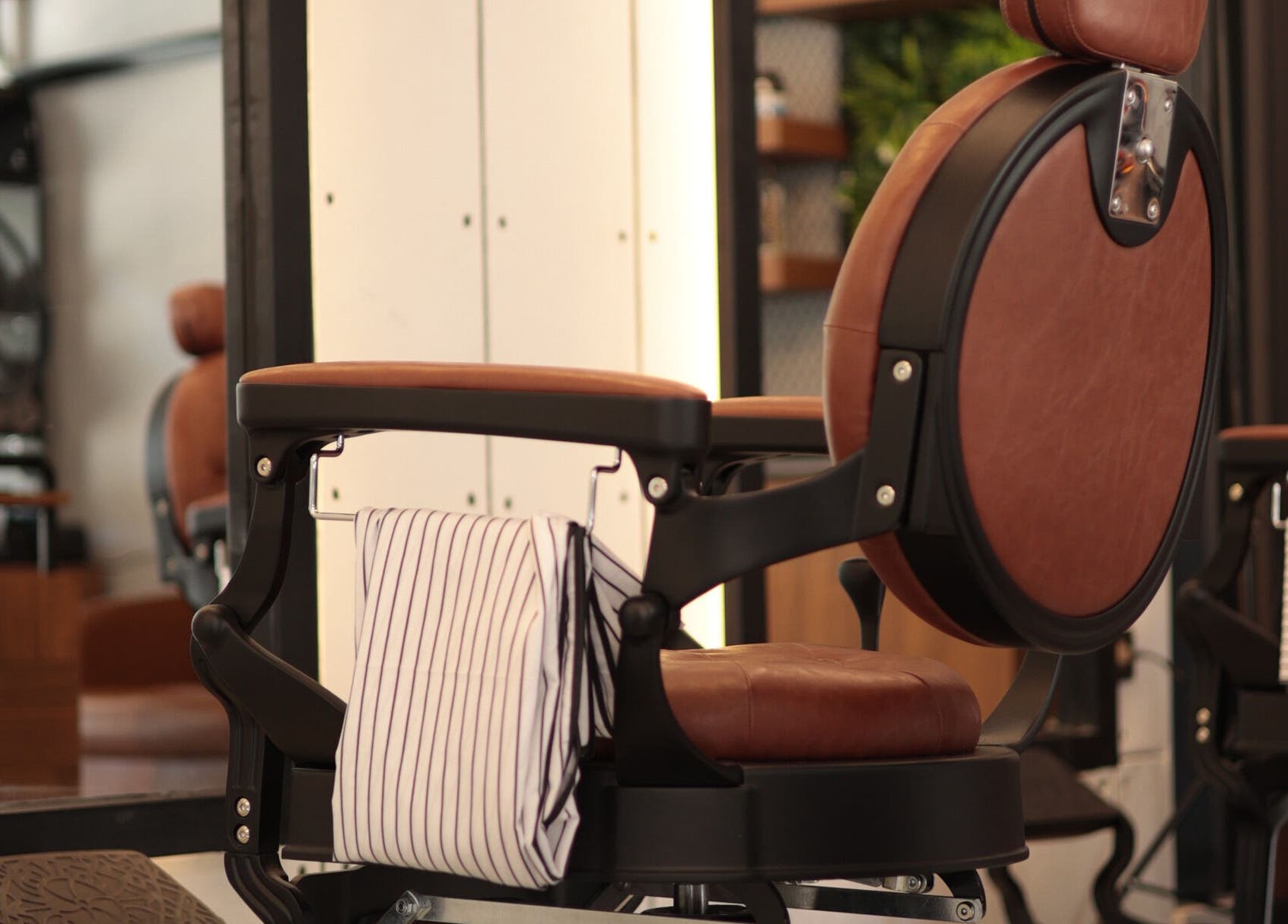 Elegant barber chair at Hair Spot, Tarablus, North Governorate, LB, showcasing modern salon style.