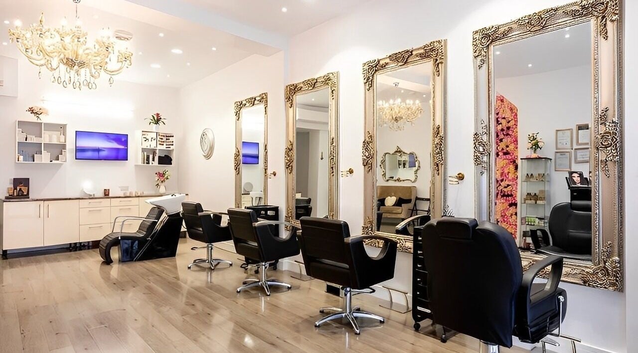 Luxurious salon chairs and mirrors at Jena Beauty in London, England, GB highlighting opulent decor.