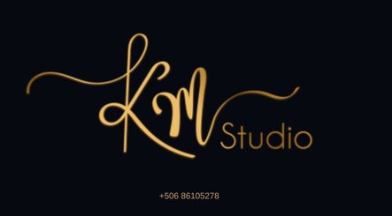KMStudio elegant gold logo on black, located in Abangares, Guanacaste, CR.