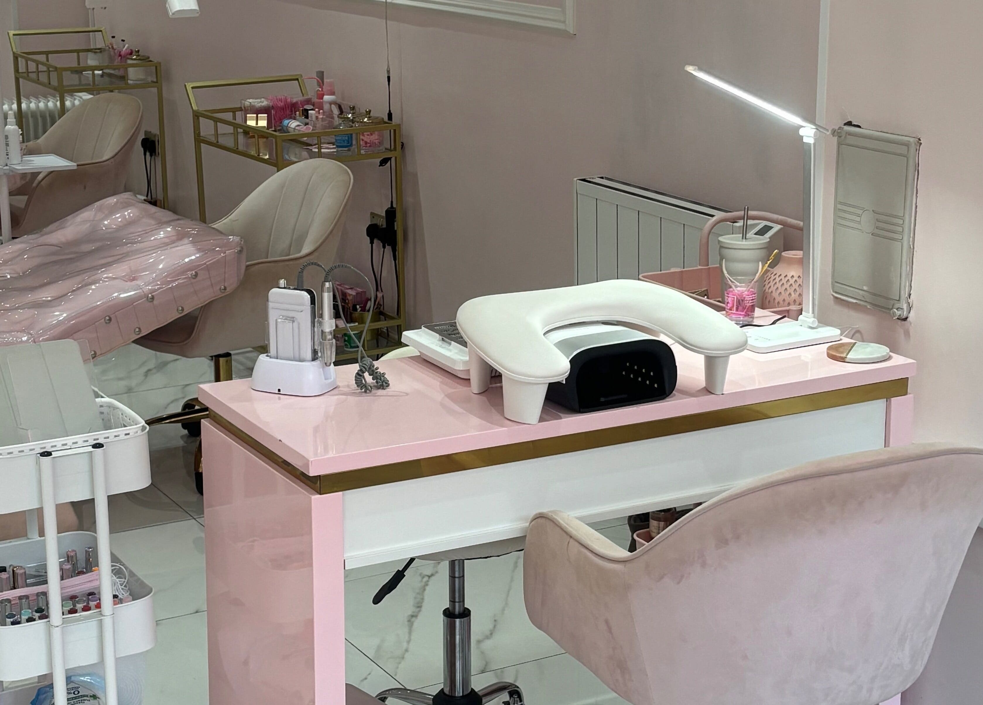 Elegant nail station at Luxury Beauty Salon, Bromsgrove, England, GB with plush seating and manicure tools.