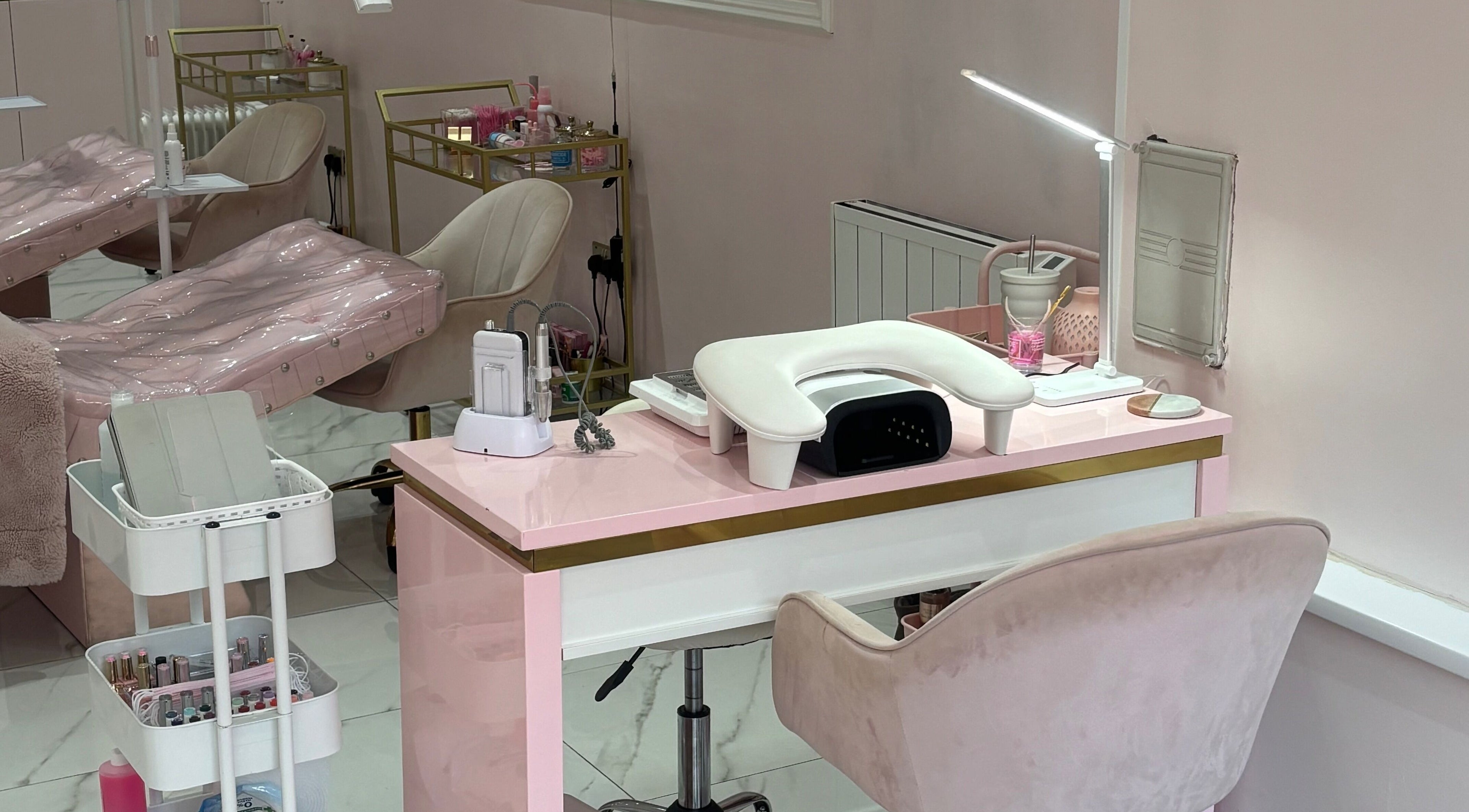Elegant nail station at Luxury Beauty Salon, Bromsgrove, England, GB with plush seating and manicure tools.