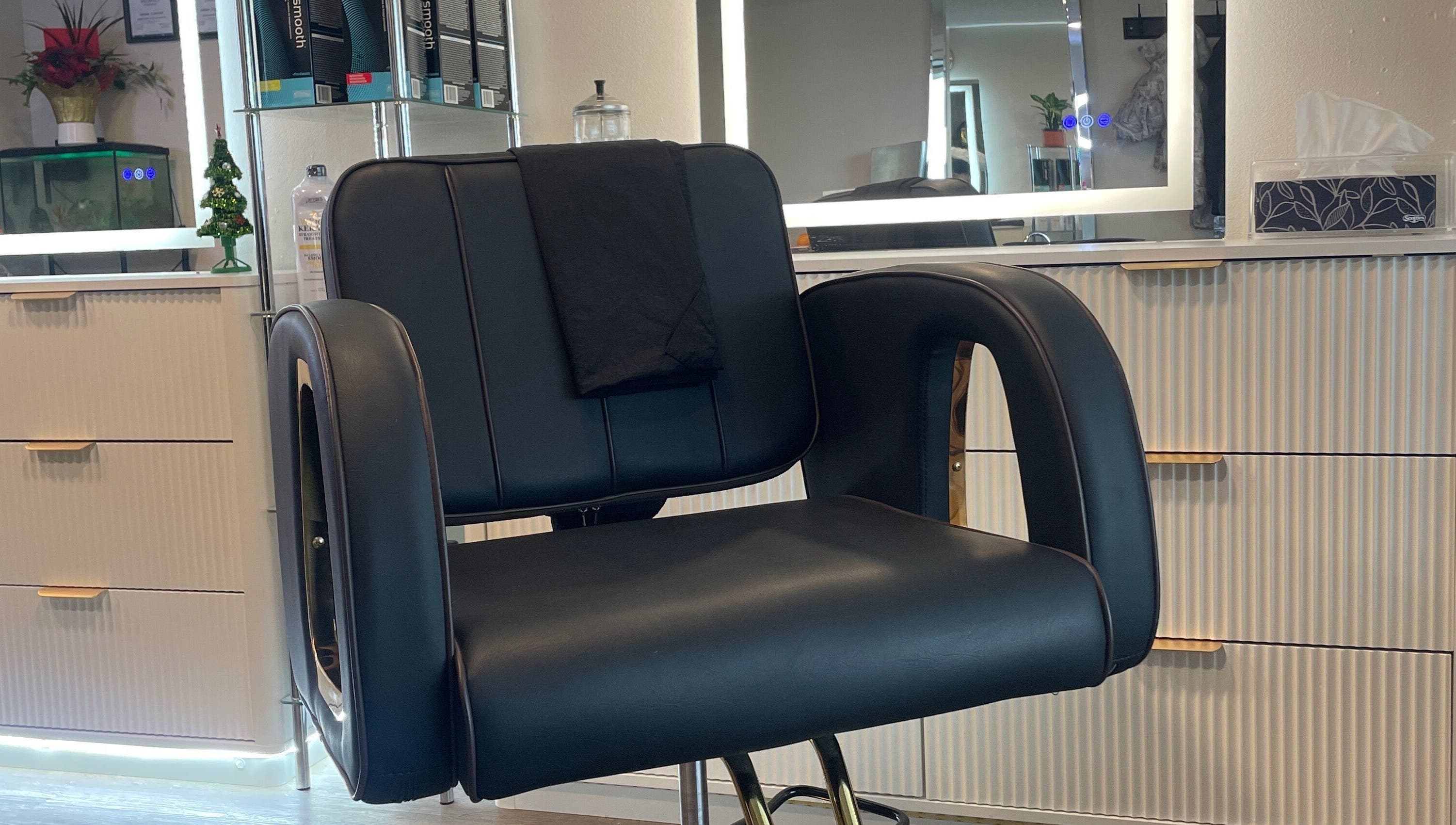 Stylish salon chair at Hair By Alyssa, Nanaimo, British Columbia, CA, showcasing luxury and comfort.