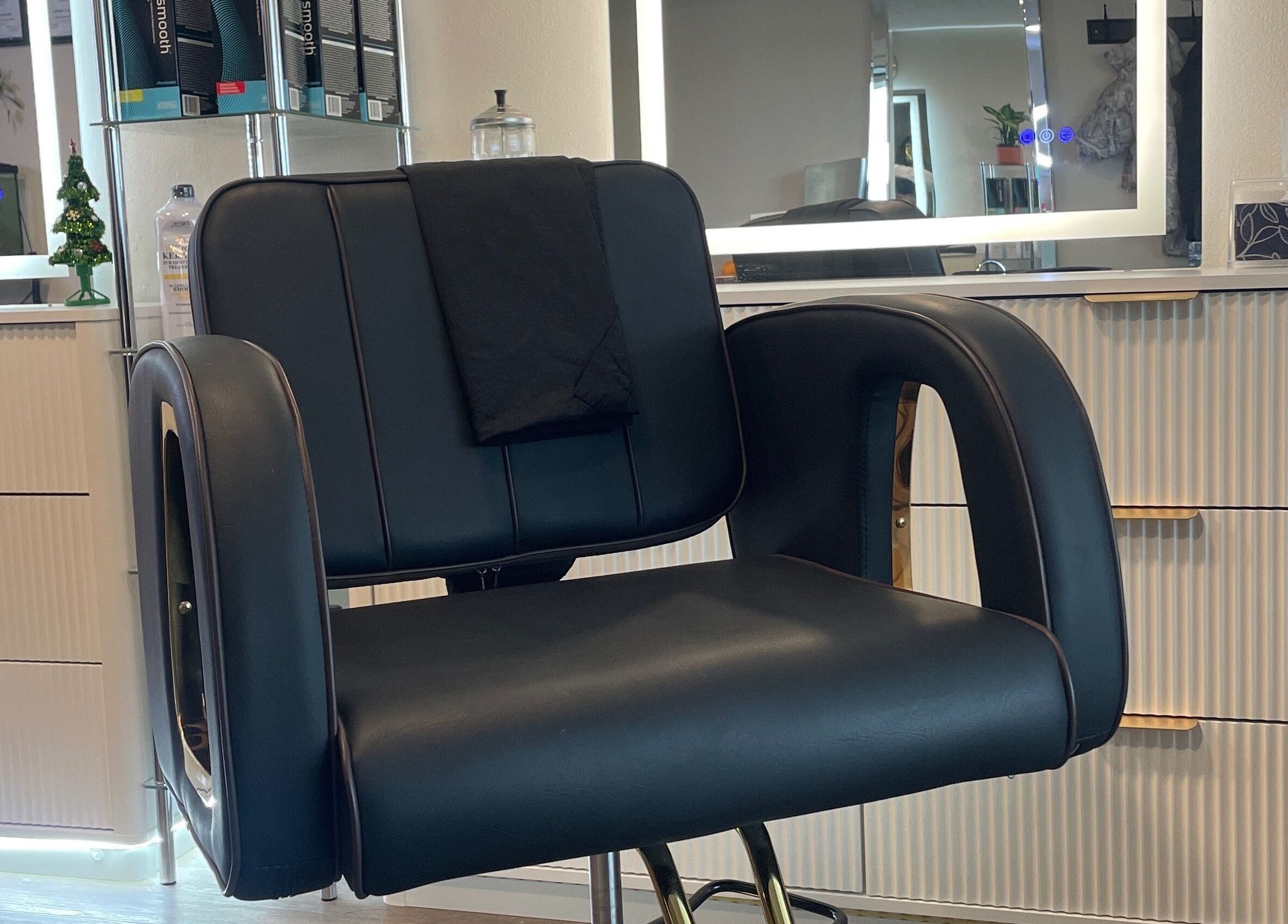 Stylish salon chair at Hair By Alyssa, Nanaimo, British Columbia, CA, showcasing luxury and comfort.
