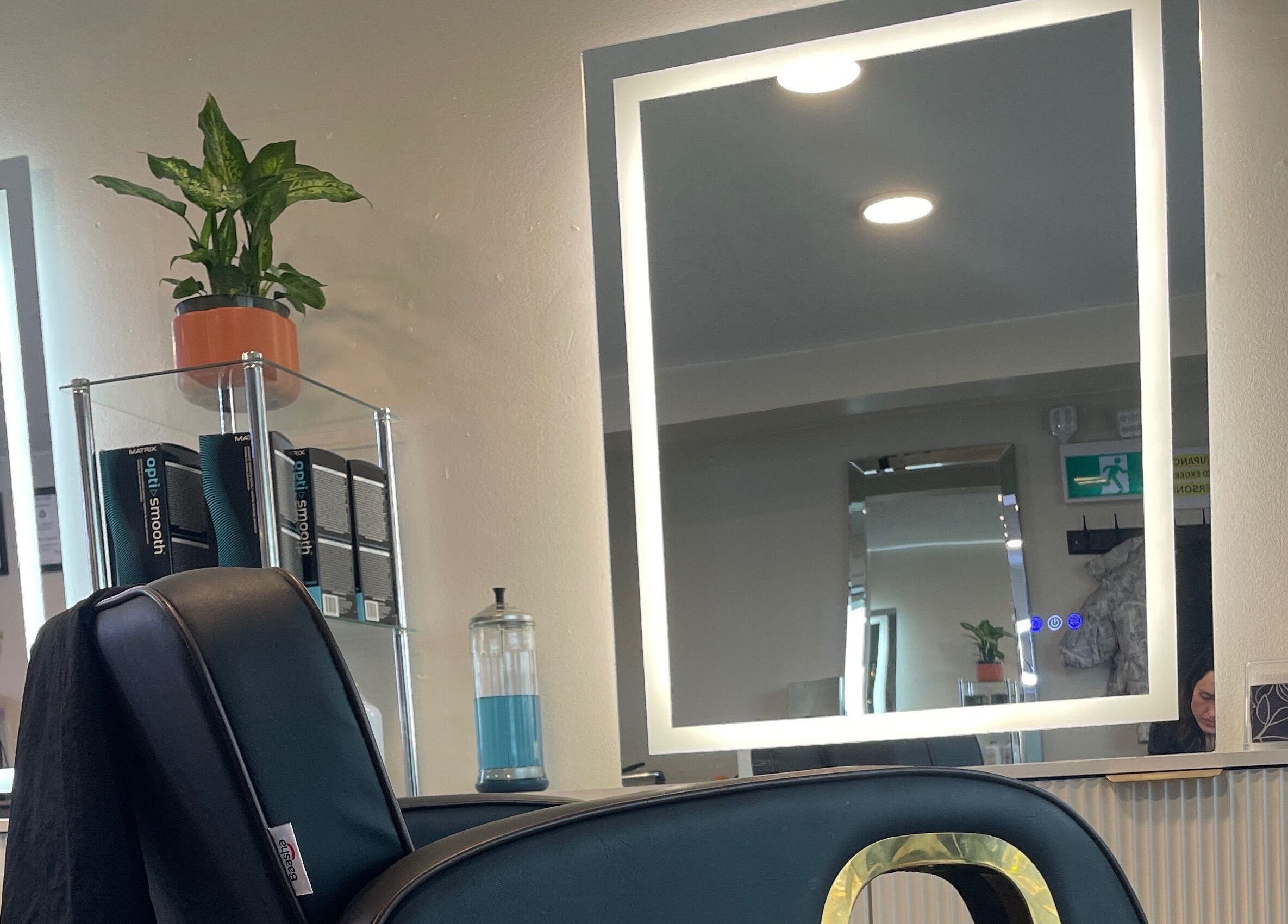 Elegant salon station at Hair By Alyssa, Nanaimo, British Columbia, CA with mirror and styling chair.