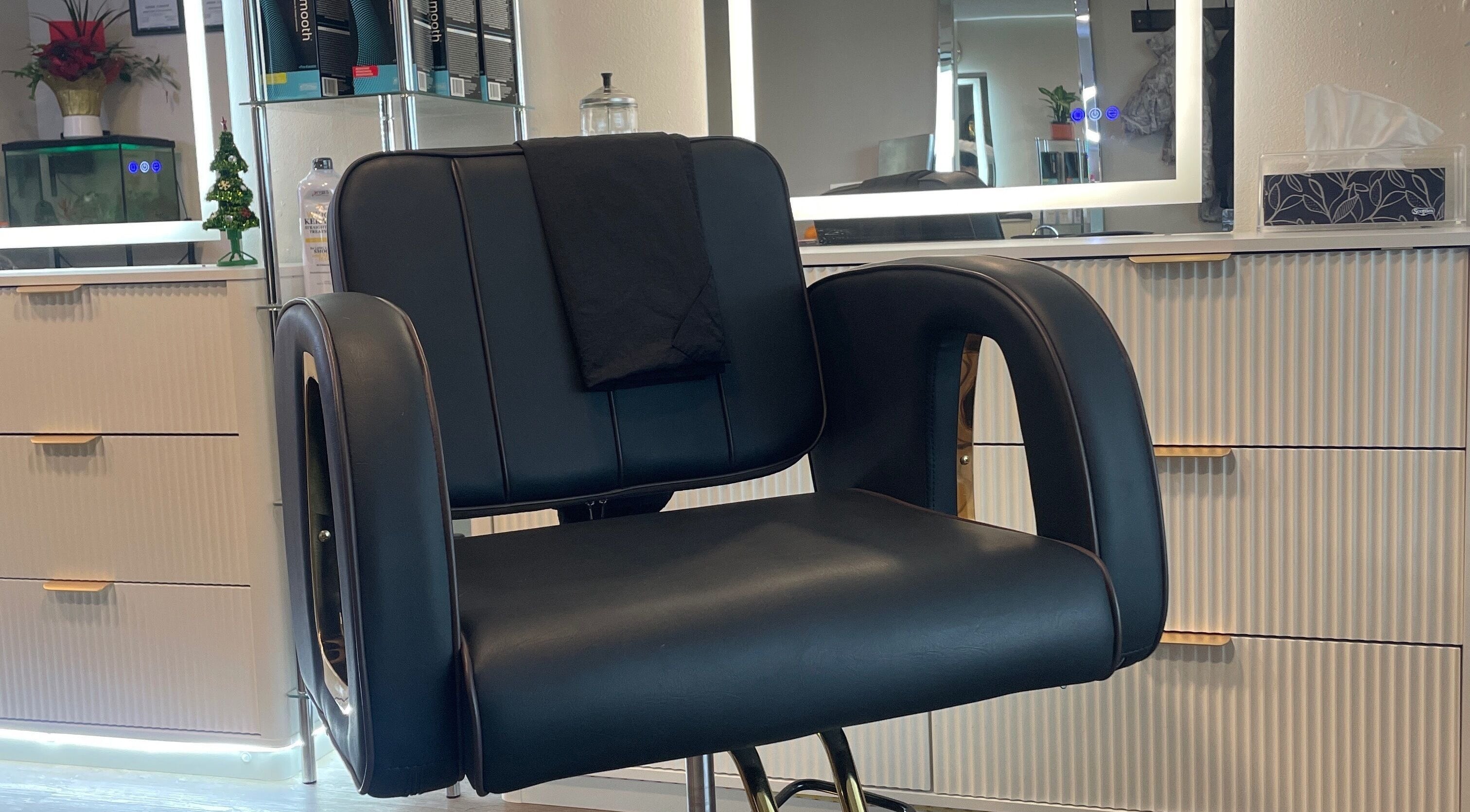 Sleek salon chair at Hair By Alyssa, Nanaimo, British Columbia, CA. Modern styling in a serene setting.